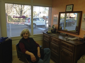 Eleonore Dunn takes a break from haircutting while she waits for customers. Photo by Cameron Saucier